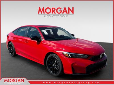 2026 Honda Civic Sedan Hybrid Sport in Rallye Red — front three-quarter view