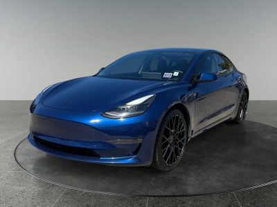 2021 Tesla Model 3 — rear three-quarter view