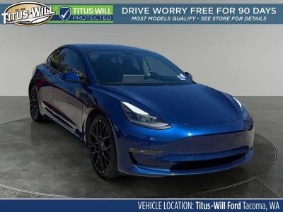 2021 Tesla Model 3 Performance in Blue — front three-quarter view