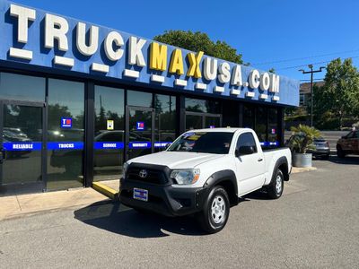 2014 Toyota Tacoma in White — front three-quarter view