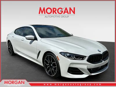 2025 BMW 8 Series 840 in White — front three-quarter view