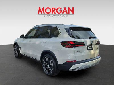 2026 BMW X5 — rear three-quarter view