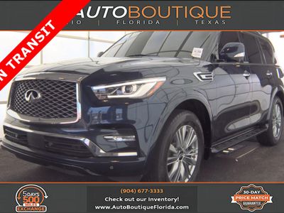 2021 INFINITI QX80 LUXE in Hermosa Blue — front three-quarter view