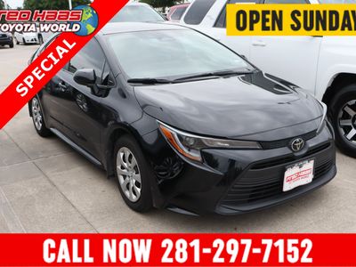 2024 Toyota Corolla LE in MIDNIGHT BLACK METALLIC — front three-quarter view