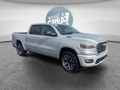 2026 RAM 1500 Laramie in Silver Zynith — front three-quarter view