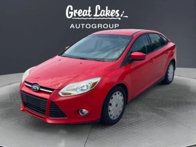2012 Ford Focus SE in Race Red — front three-quarter view