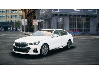 2026 BMW 5 Series 530i xDrive in Alpine White — front three-quarter view