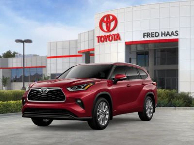 2026 Toyota Highlander Hybrid Limited in Ruby Flare Pearl 1 — front three-quarter view