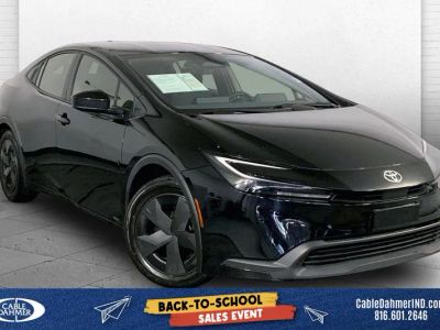 2025 Toyota Prius LE in Midnight Black Me — front three-quarter view