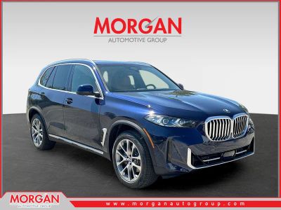 2026 BMW X5 sDrive40i in Tanzanite Blue II Metallic — front three-quarter view