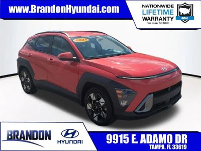 2024 Hyundai Kona SEL in Orange — front three-quarter view