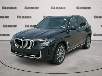2026 BMW X5 xDrive40i in Black Sapphire Metallic — front three-quarter view