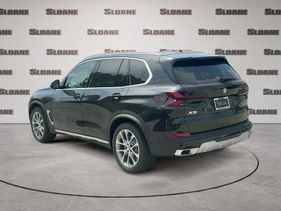 2026 BMW X5 — rear three-quarter view