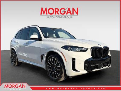 2026 BMW X5 xDrive50e in Alpine White — front three-quarter view