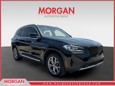 2022 BMW X3 xDrive30i in Black Sapphire Metallic — front three-quarter view