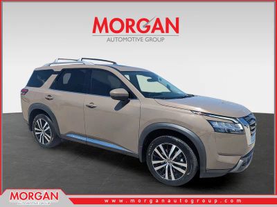 2024 Nissan Pathfinder Platinum in Baja Storm — front three-quarter view