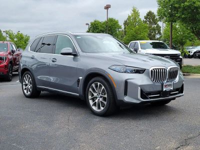 2026 BMW X5 xDrive50e in Skyscraper Grey Metallic — front three-quarter view