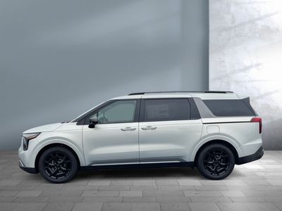 2026 Kia Carnival Hybrid — rear three-quarter view