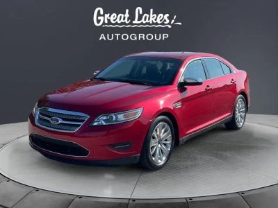 2012 Ford Taurus Limited in Red Candy Metallic Tinted Clearcoat — front three-quarter view