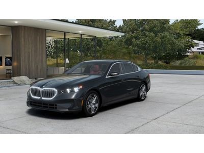2026 BMW 5 Series 530i xDrive in Dark Graphite Metallic — front three-quarter view