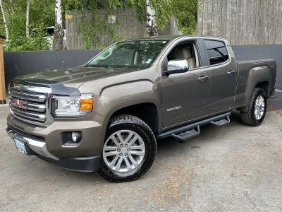 2016 GMC Canyon 4WD SLT in Bronze Alloy Metallic — front three-quarter view