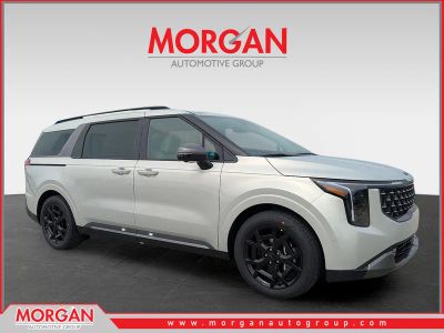 2026 Kia Carnival SX Prestige in Ivory Silver — front three-quarter view