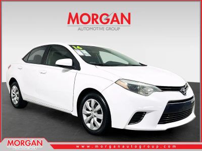 2016 Toyota Corolla LE in White — front three-quarter view