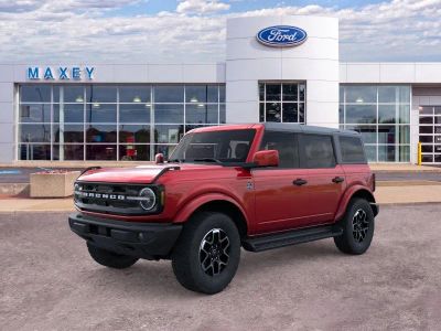 2026 Ford Bronco Outer Banks® in Ruby Red Metallic Tinted Clearcoat — front three-quarter view