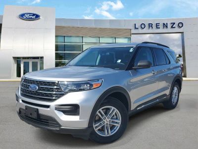 2023 Ford Explorer XLT in Iconic Silver Metallic — front three-quarter view