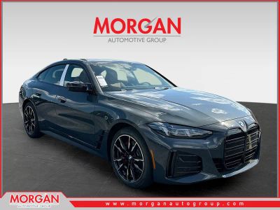2026 BMW i4 M60 in Gray — front three-quarter view