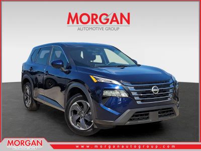 2024 Nissan Rogue SV in Deep Ocean Blue Pearl — front three-quarter view