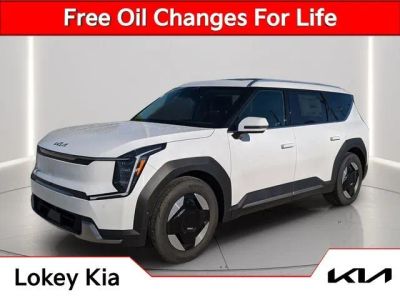 2026 Kia EV9 Wind in Glacial White Pearl — front three-quarter view
