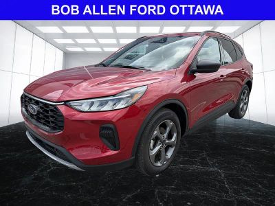 2025 Ford Escape ST-Line in Rapid Red Metallic Tinted Clearcoat — front three-quarter view