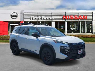 2026 Nissan Rogue Rock Creek in Everest White Pearl Tricoat — front three-quarter view