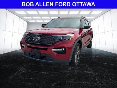 2021 Ford Explorer XLT in Rapid Red Metallic Tinted Clearcoat — front three-quarter view