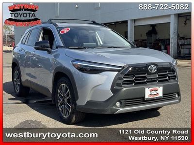 2026 Toyota Corolla Cross XLE in Sonic Silver — front three-quarter view