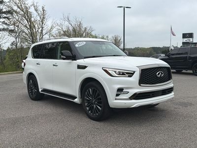 2023 INFINITI QX80 Premium Select in Moonstone White — front three-quarter view