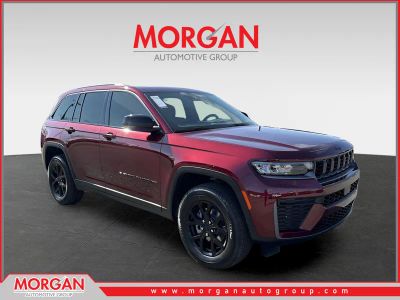 2026 Jeep Grand Cherokee Laredo in Red — front three-quarter view