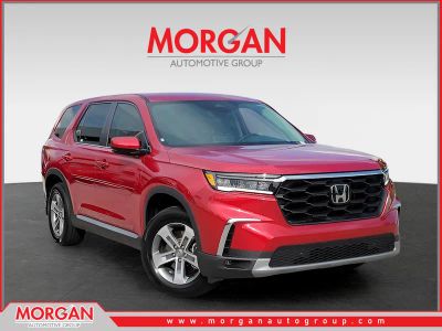 2024 Honda Pilot EX-L 8 Passenger in Radiant Red Metallic II — front three-quarter view
