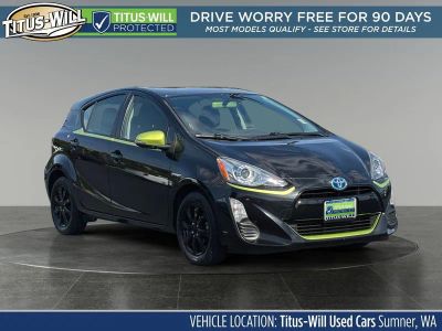 2016 Toyota Prius c Persona Series in Black Sand Pearl — front three-quarter view