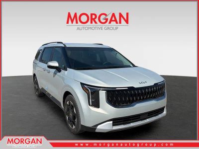 2026 Kia Carnival EX in Ivory Silver — front three-quarter view