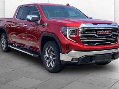 2026 GMC Sierra 1500 SLT in Volcanic Red Tintcoat — front three-quarter view