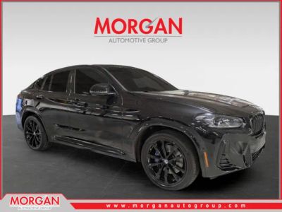 2023 BMW X4 M40i in Black — front three-quarter view