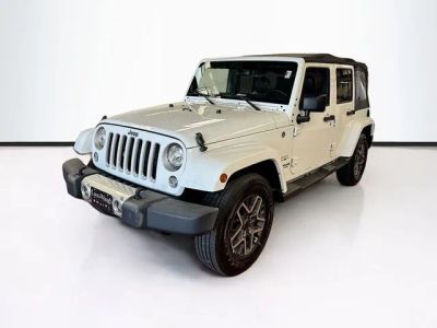 2017 Jeep Wrangler Unlimited Sahara in Bright White Clearcoat — front three-quarter view