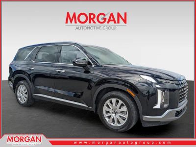 2024 Hyundai Palisade SEL 7P in Abyss Black Pearl — front three-quarter view
