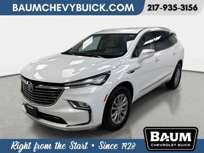 2023 Buick Enclave Essence in Summit White — front three-quarter view