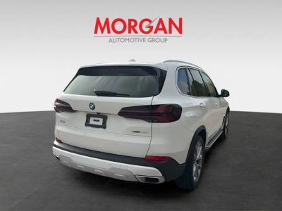 2025 BMW X5 — rear three-quarter view