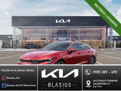 2025 Kia K5 EX in Runway Red — front three-quarter view