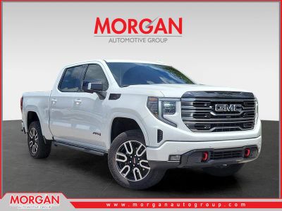2025 GMC Sierra 1500 AT4 in Summit White — front three-quarter view