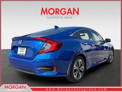 2017 Honda Civic Sedan — rear three-quarter view